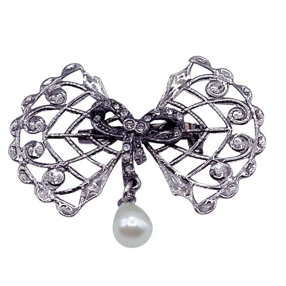 Vintage Bow & rhinestone ribbon with dangle faux pearl.